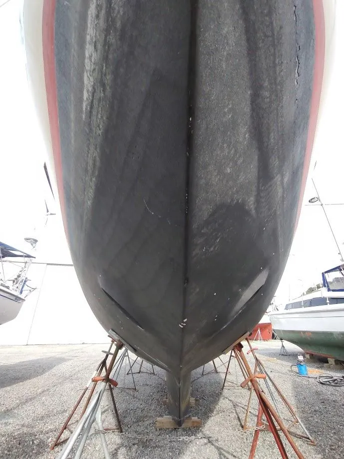 Slide: The Image of Bottom view of a 1981 Bruce Roberts 450 boat hull on stands. - 13