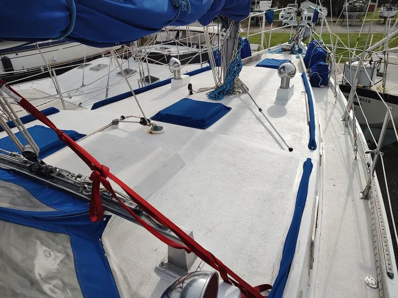 Slide: The Image of Sailboat deck of 1981 Bruce Roberts 450 with blue covers and rigging. - 15
