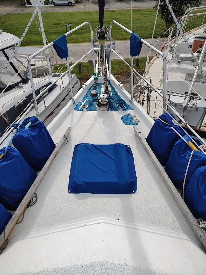 Slide: The Image of Sailboat deck of 1981 Bruce Roberts 450 with blue covers and winches. - 17