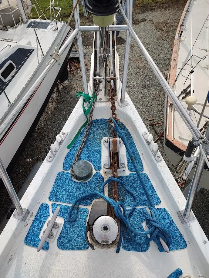 Slide: The Image of Bow of 1981 Bruce Roberts 450 sailboat with anchor chain and ropes. - 18