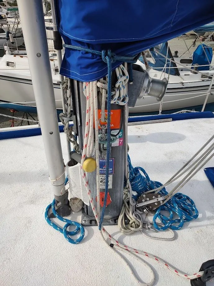 Slide: The Image of Mast base of 1981 Bruce Roberts 450 sailboat with ropes and winch. - 23