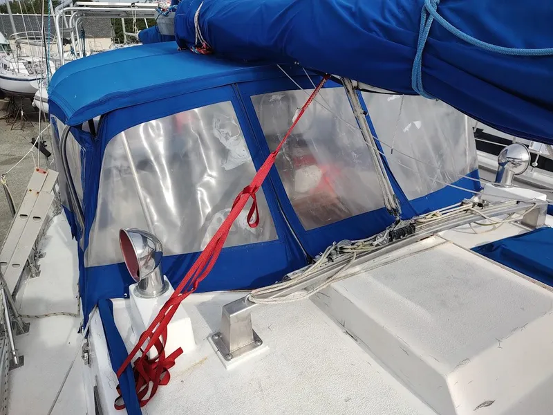 Slide: The Image of Sailboat cockpit with blue canvas cover, Bruce Roberts 450, 1981 model. - 26