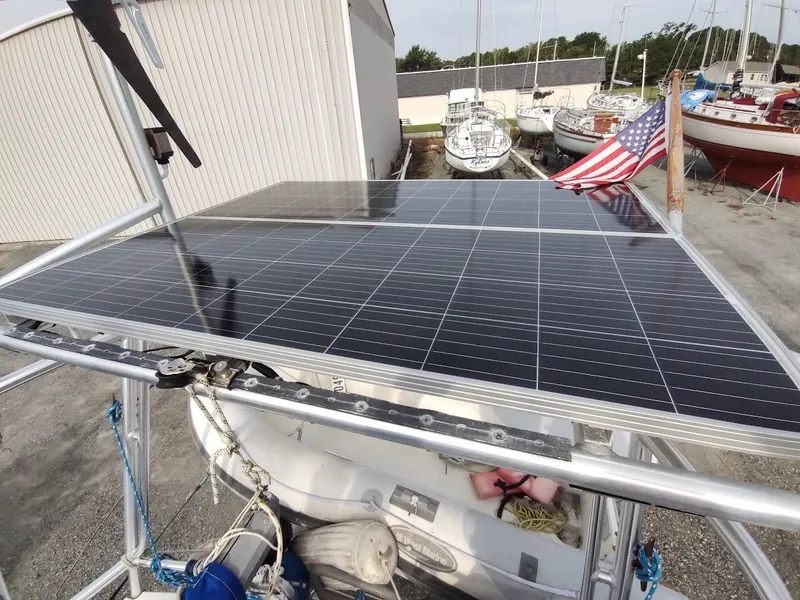 Slide: The Image of Solar panels on a 1981 Bruce Roberts 450 sailboat with American flag in marina. - 33