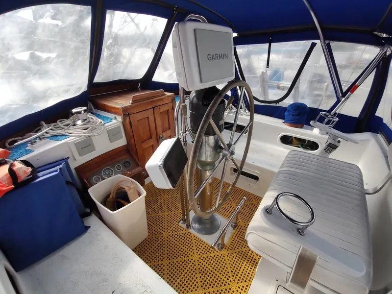 Slide: The Image of Interior of 1981 Bruce Roberts 450 sailboat with steering wheel and navigation equipment. - 40