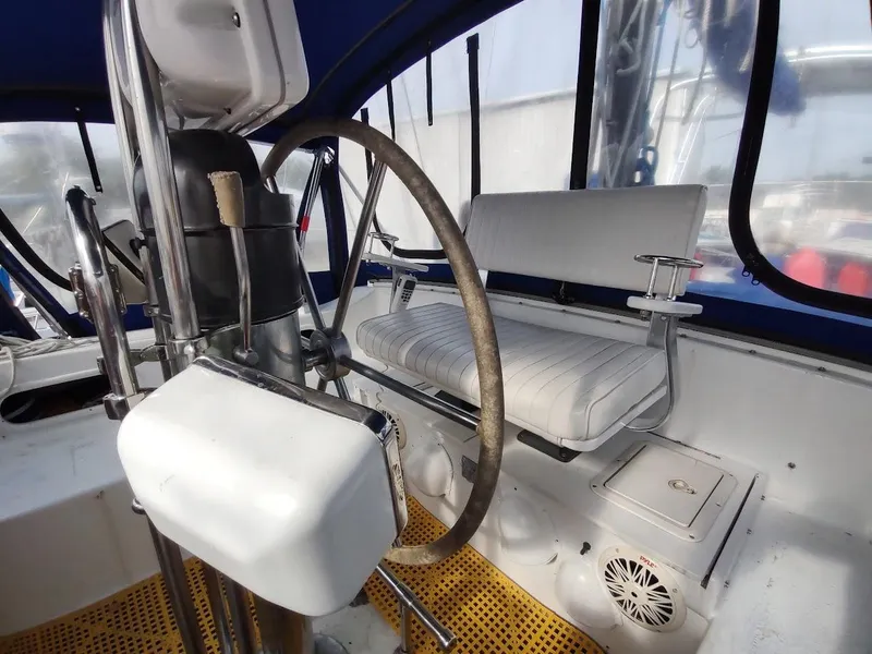 Slide: The Image of Cockpit of 1981 Bruce Roberts 450 sailboat with steering wheel and seating. - 44