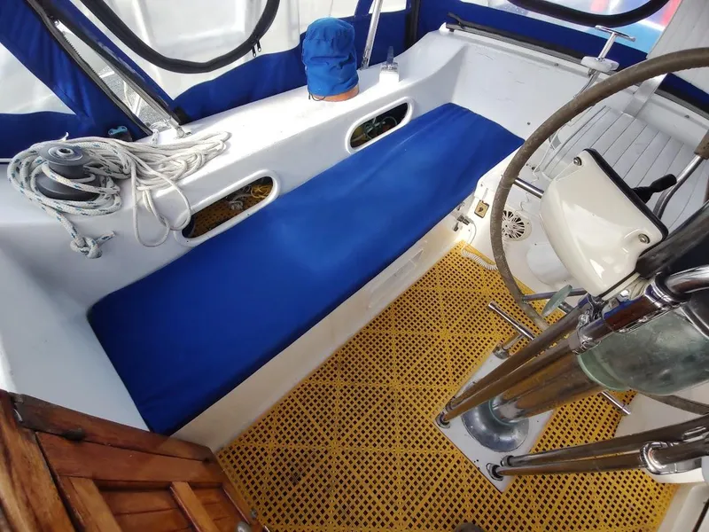 Slide: The Image of Cockpit of 1981 Bruce Roberts 450 sailboat with blue seating and yellow flooring. - 45