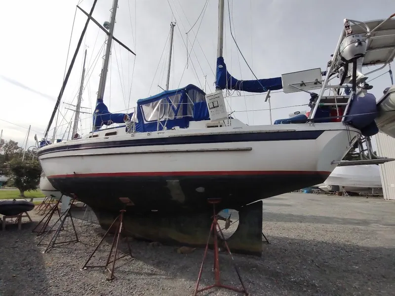 Slide: The Image of 1981 Bruce Roberts 450 sailboat on stands, ready for maintenance in a boatyard. - 8