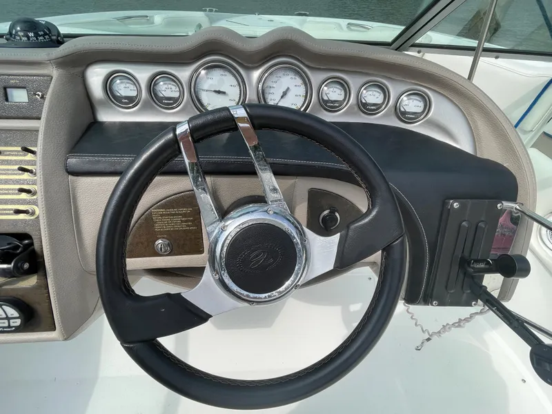 Slide: The Image of Steering wheel and dashboard of a 2006 Cobalt 24SX boat. - 16