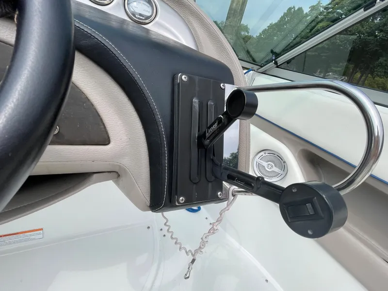 Slide: The Image of Close-up of the control panel on a 2006 Cobalt 24SX boat. - 18