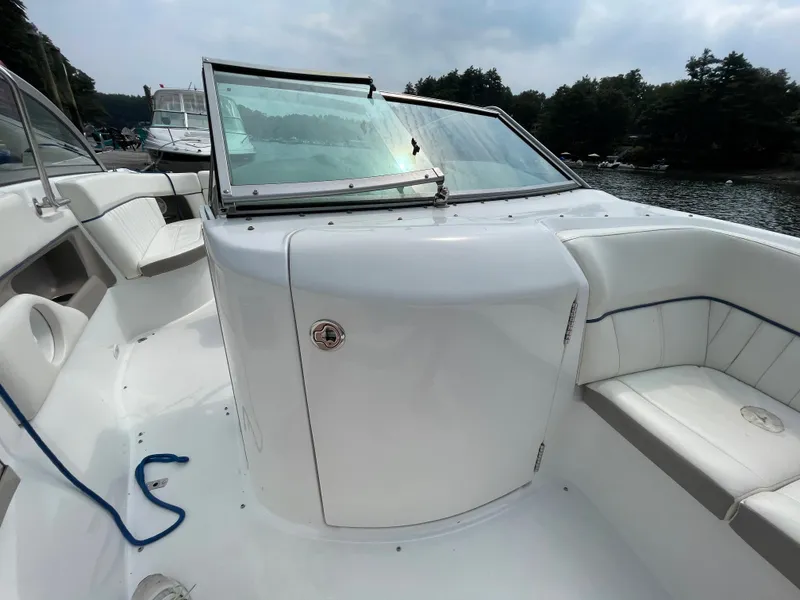 Slide: The Image of 2006 Cobalt 24SX boat interior with white seating and windshield. - 22