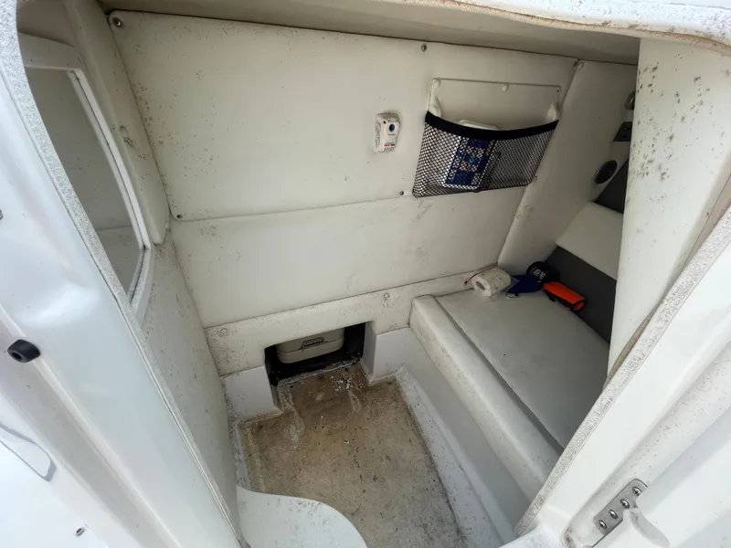 Slide: The Image of 2006 Cobalt 24SX boat interior cabin with seating and storage. - 26