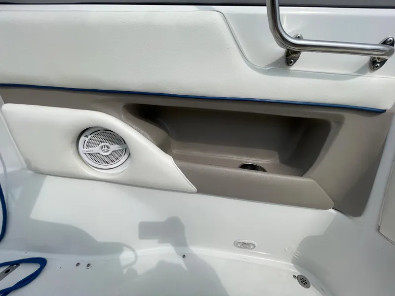 Slide: The Image of Interior detail of a 2006 Cobalt 24SX boat showing speaker and storage compartment. - 28