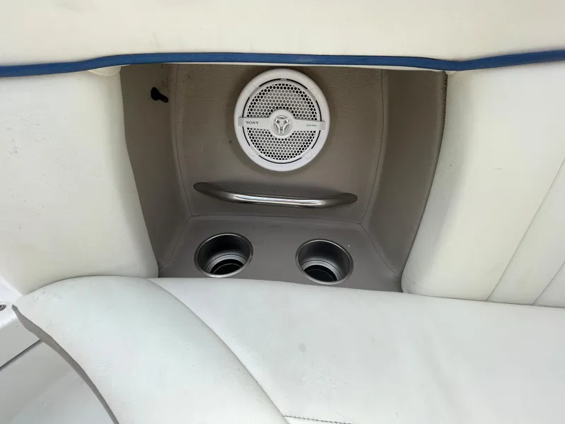 Slide: The Image of 2006 Cobalt 24SX boat interior with speaker and cup holders. - 29
