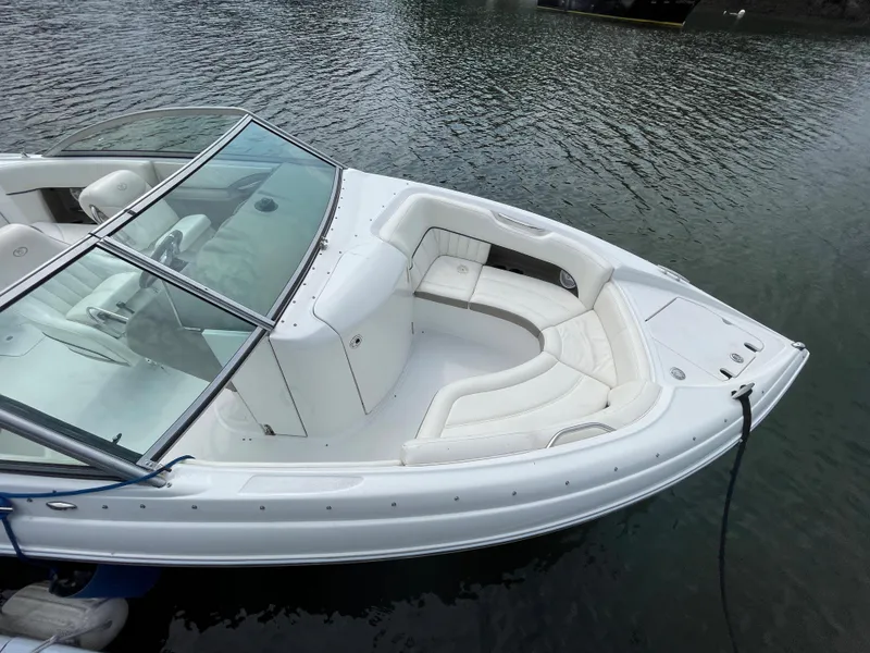 Slide: The Image of 2006 Cobalt 24SX boat with white interior on calm water. - 3