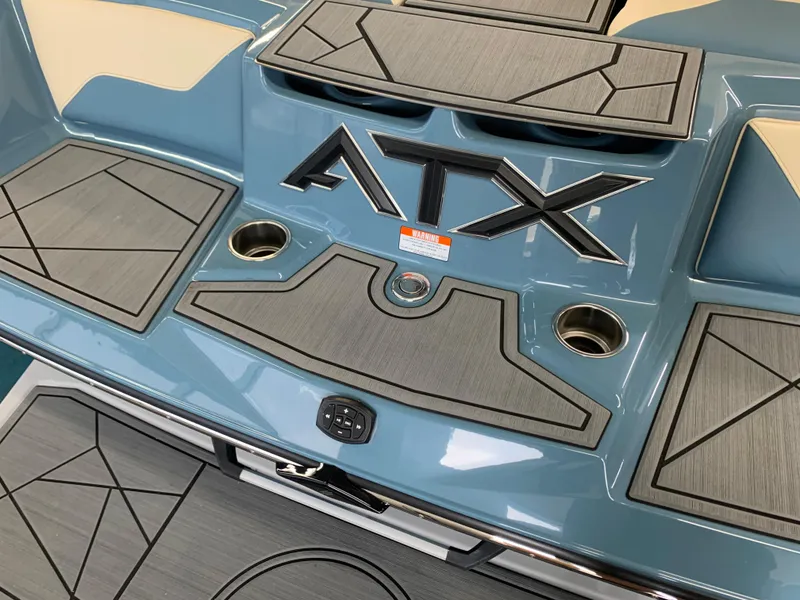 Slide: The Image of 2023 ATX Surf Boats 24 Type-S rear deck with logo and cup holders. - 11
