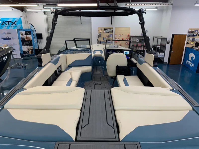 Slide: The Image of 2023 ATX Surf Boats 24 Type-S interior, spacious seating, modern design, showroom display. - 9