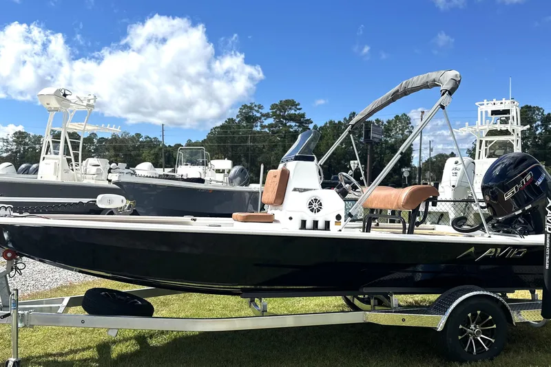 The Image of 2026 Avid 19 FSX boat on trailer under blue sky. - 0