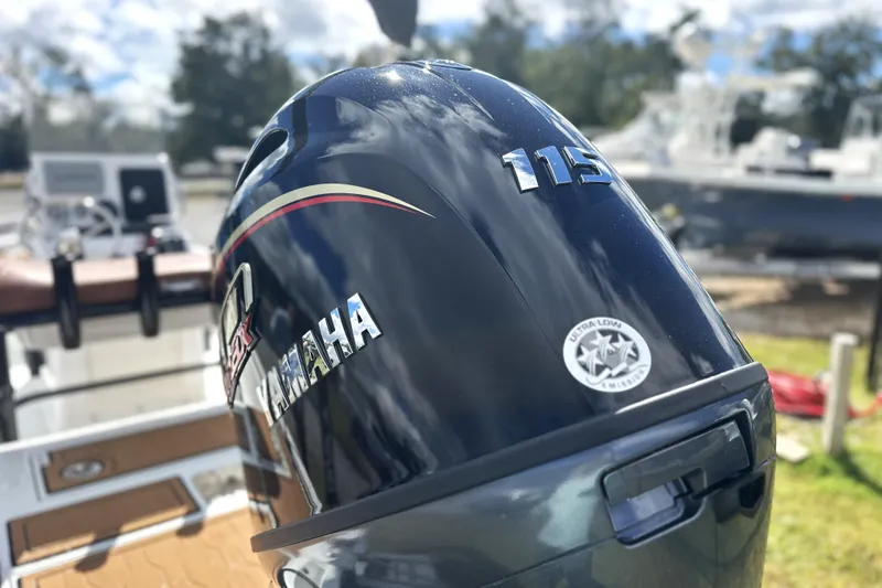 Slide: The Image of Yamaha 115 outboard motor on Avid 19 FSX boat, 2026 model, with ultra-low emission sticker. - 14
