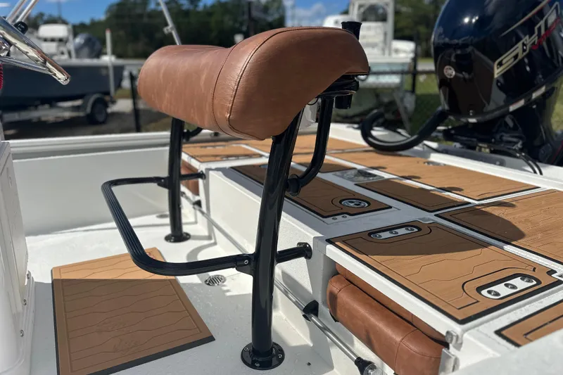 Slide: The Image of 2026 Avid 19 FSX boat interior with brown leather seating and sleek design. - 18