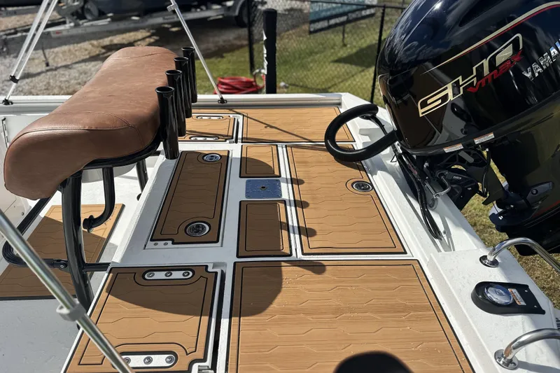 Slide: The Image of Avid 19 FSX 2026 boat deck with Yamaha SHO VMAX engine and brown seating. - 6