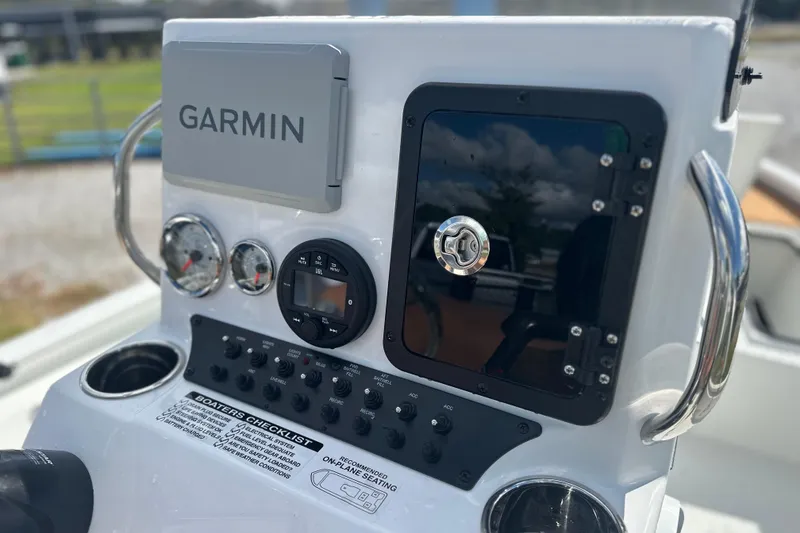 Slide: The Image of Control panel of 2026 Avid 19 FSX boat featuring Garmin navigation system. - 7