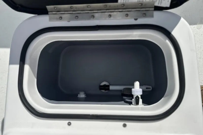 Slide: The Image of Open storage compartment in 2026 Avid 19 FSX boat, showing interior details. - 9