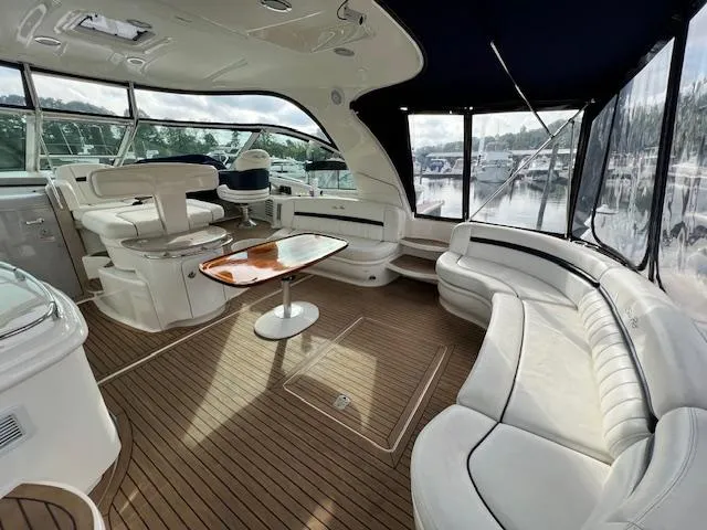 Slide: The Image of Luxurious 2005 Sea Ray 500 Sundancer yacht interior with elegant seating and wooden flooring. - 11