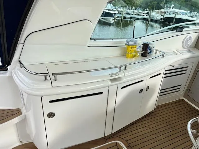 Slide: The Image of 2005 Sea Ray 500 Sundancer yacht interior with sleek cabinetry and modern design. - 14