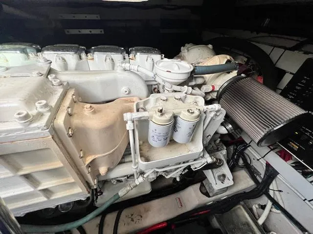 Slide: The Image of Engine compartment of a 2005 Sea Ray 500 Sundancer boat, showcasing mechanical components. - 22