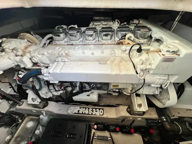 Slide: The Image of Engine compartment of a 2005 Sea Ray 500 Sundancer, showcasing detailed mechanical components. - 23