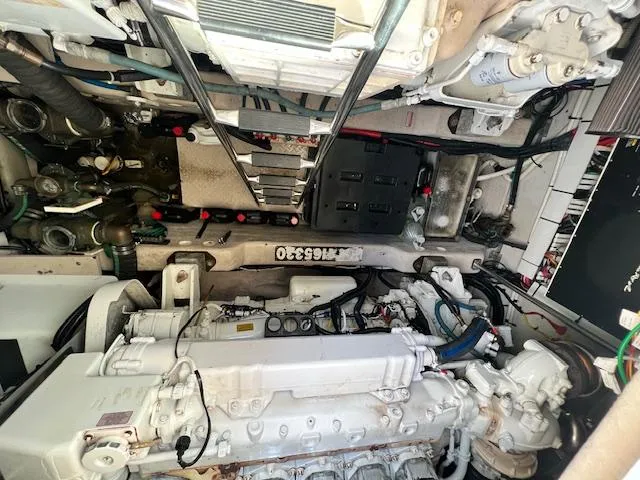 Slide: The Image of Engine room of a 2005 Sea Ray 500 Sundancer, showcasing mechanical components and systems. - 24