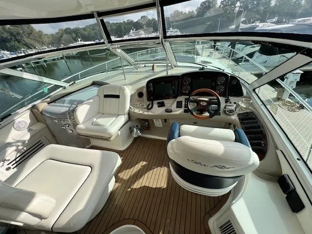 Slide: The Image of Luxurious 2005 Sea Ray 500 Sundancer yacht cockpit with plush seating and modern controls. - 25
