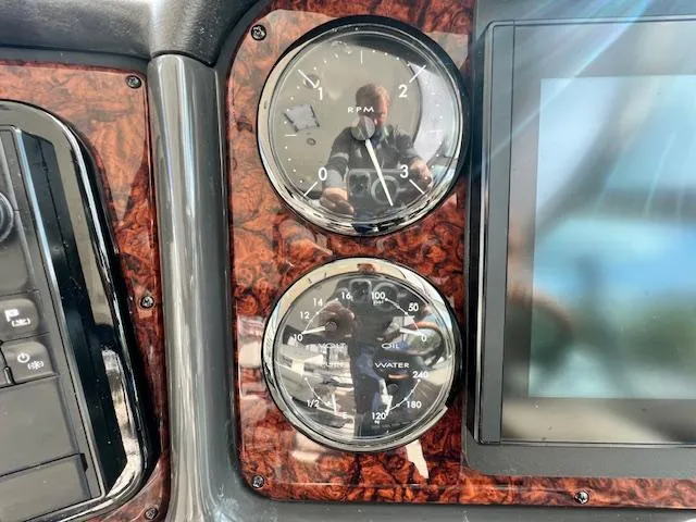 Slide: The Image of Dashboard of 2005 Sea Ray 500 Sundancer with RPM and water gauges. - 36