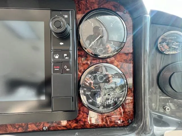 Slide: The Image of Dashboard of a 2005 Sea Ray 500 Sundancer with gauges and controls. - 37