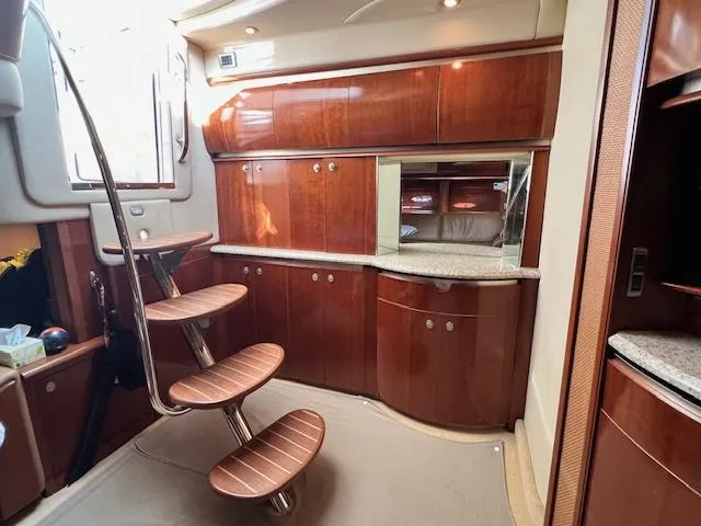 Slide: The Image of Luxurious interior of 2005 Sea Ray 500 Sundancer yacht with elegant wood cabinetry. - 41