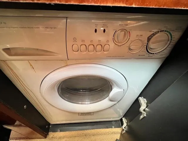 Slide: The Image of Washing machine inside 2005 Sea Ray 500 Sundancer yacht, compact and efficient design. - 42