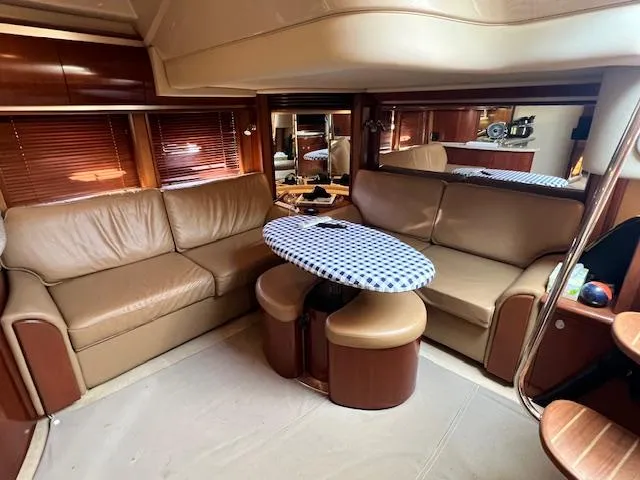 Slide: The Image of Luxurious interior of 2005 Sea Ray 500 Sundancer yacht with leather seating and oval table. - 45