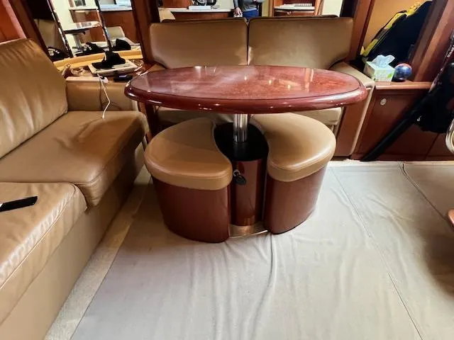 Slide: The Image of Luxurious interior of 2005 Sea Ray 500 Sundancer with elegant seating and table. - 46