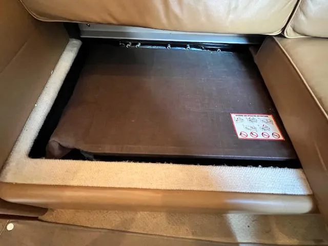 Slide: The Image of 2005 Sea Ray 500 Sundancer interior storage compartment under seat. - 48