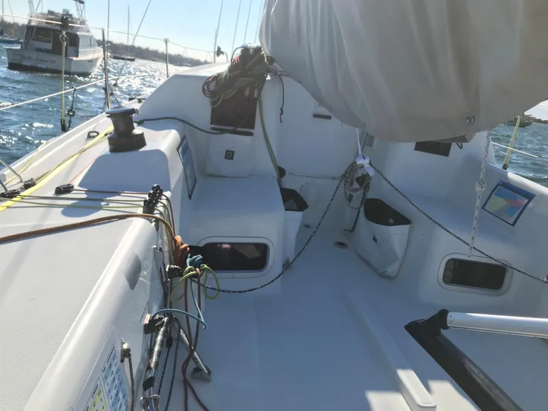 Slide: The Image of 2023 Jeanneau Sun Fast 3300 sailboat cockpit with rigging and winches on a sunny day. - 18