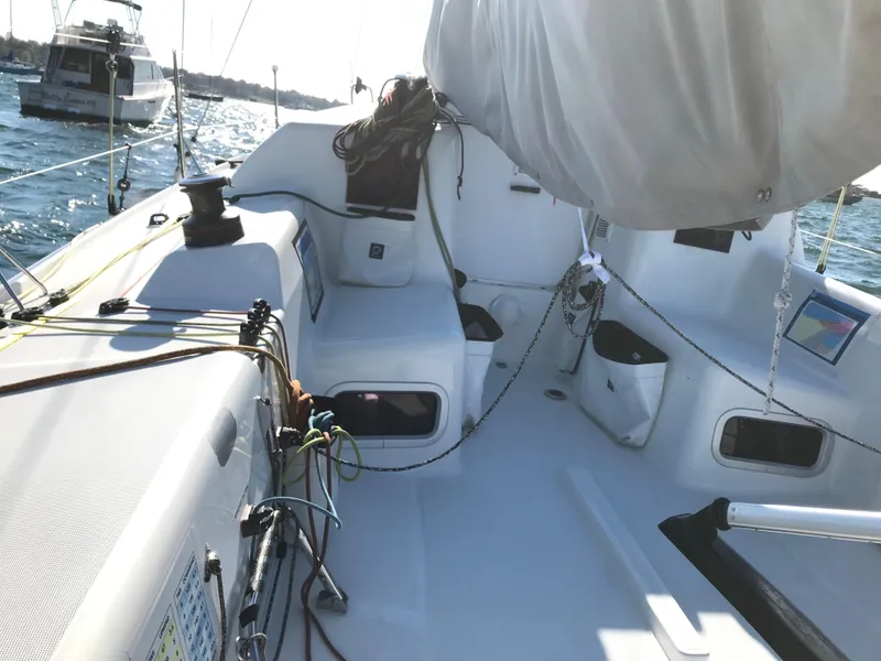 Slide: The Image of 2023 Jeanneau Sun Fast 3300 sailboat cockpit with rigging and equipment on a sunny day. - 19