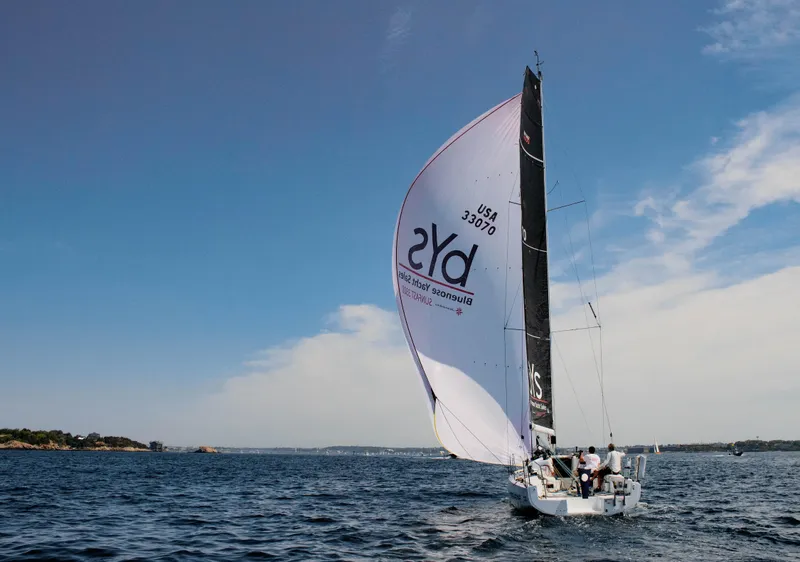 Slide: The Image of 2023 Jeanneau Sun Fast 3300 sailing on open water under clear skies. - 4