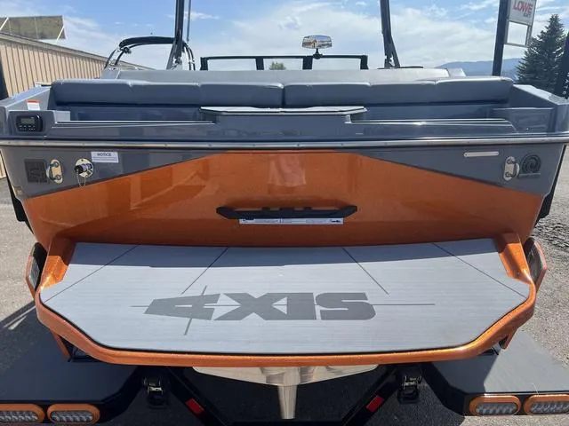 Slide: The Image of 2023 Axis Wake Research T220 boat rear view with swim platform. - 10