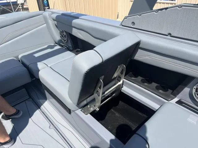 Slide: The Image of 2023 Axis Wake Research T220 boat interior with adjustable seating and storage. - 15