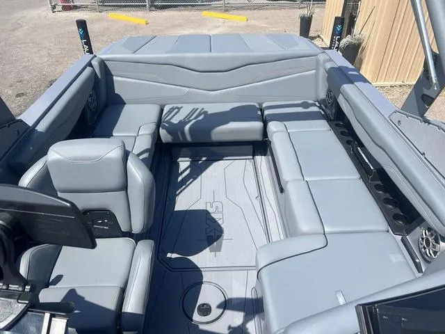 Slide: The Image of 2023 Axis Wake Research T220 boat interior with gray seating and spacious layout. - 8