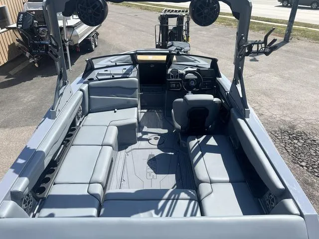 Slide: The Image of 2023 Axis Wake Research T220 boat interior with spacious seating and advanced audio system. - 9