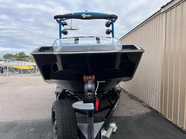 Slide: The Image of 2021 Malibu M220 boat on trailer, front view. - 5