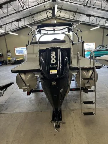 Slide: The Image of 2023 Avalon 25 Catalina Rear J Lounger with 300 V8 engine in a garage. - 11