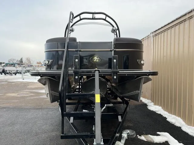 Slide: The Image of 2023 Avalon 25 Catalina Rear J Lounger pontoon boat on trailer, front view. - 3