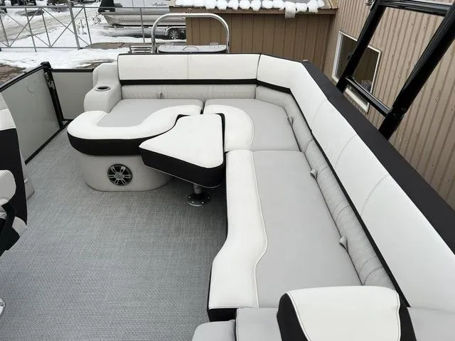 Slide: The Image of 2023 Avalon 25 Catalina Rear J Lounger with luxurious white and black seating. - 7